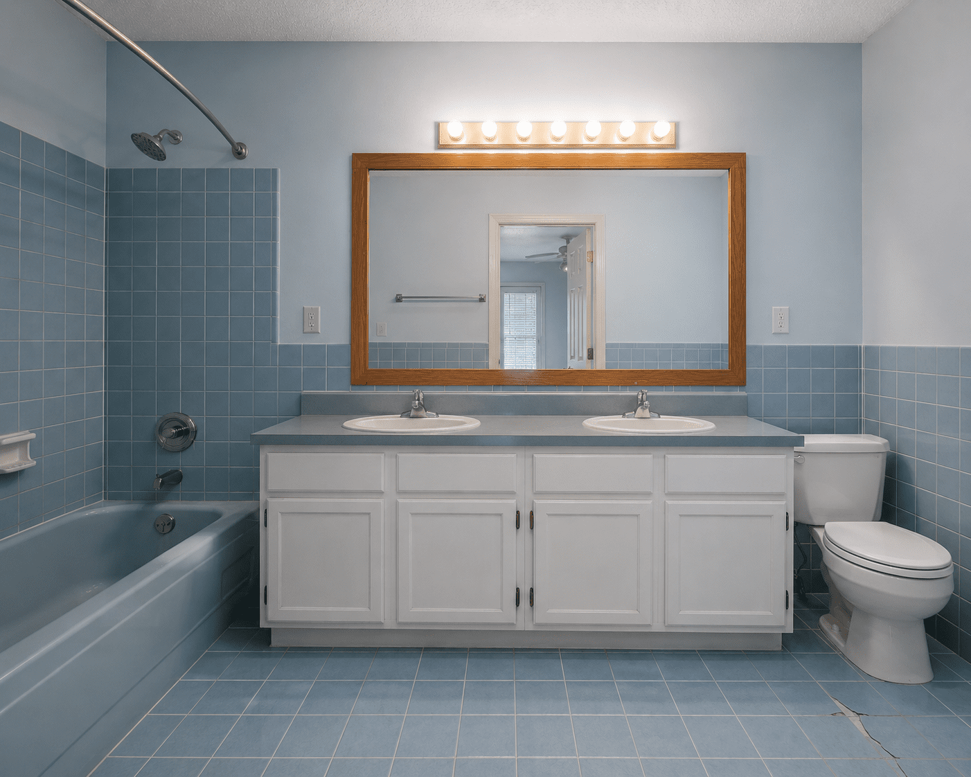 Before — blue tile bathroom in Clarksburg, MD