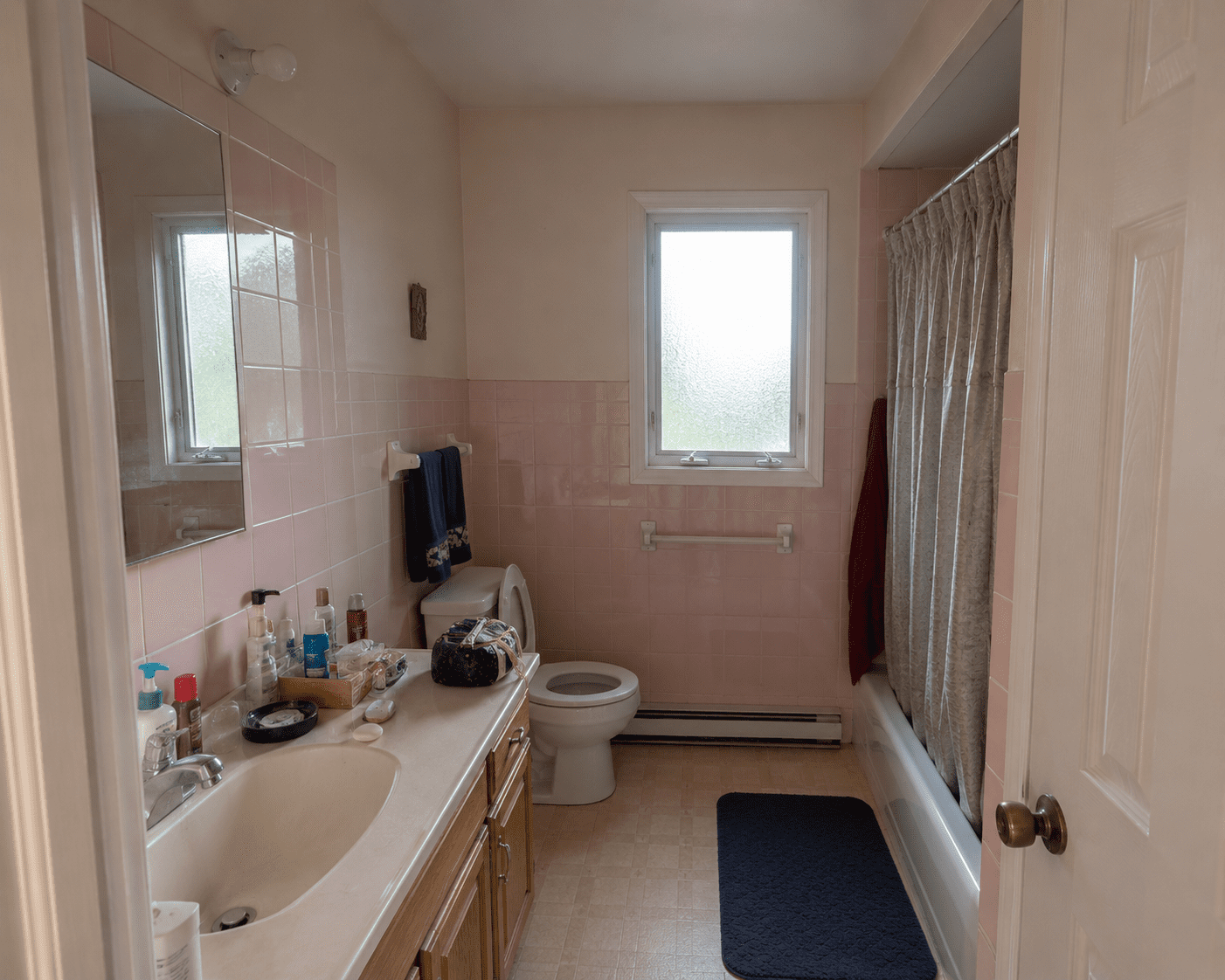 Before — mid-century pink tile bathroom in Germantown, MD